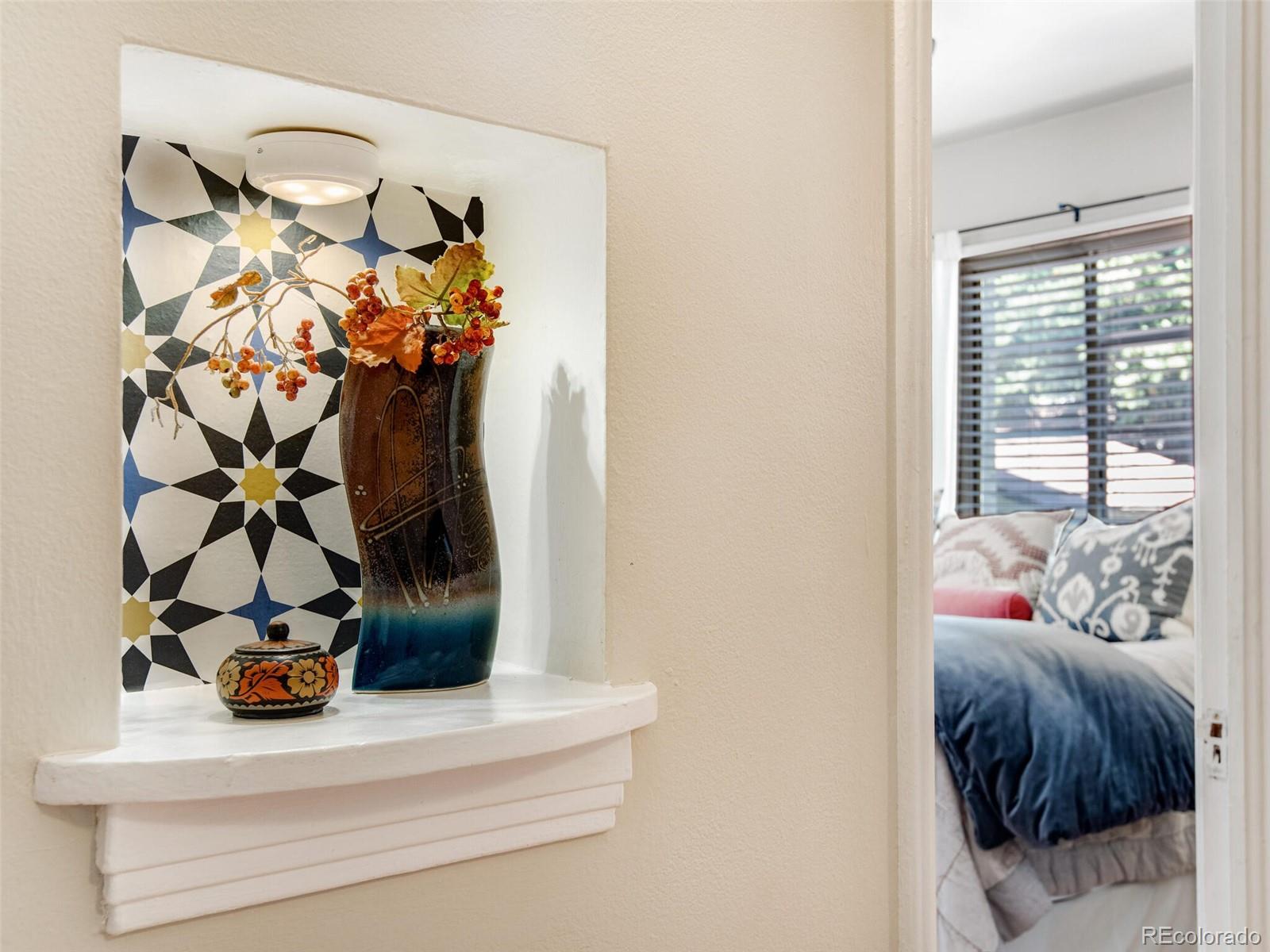 520 East 5th Avenue Denver, CO 80203 - Photo 21 of 40 a bedroom with a bed and a window