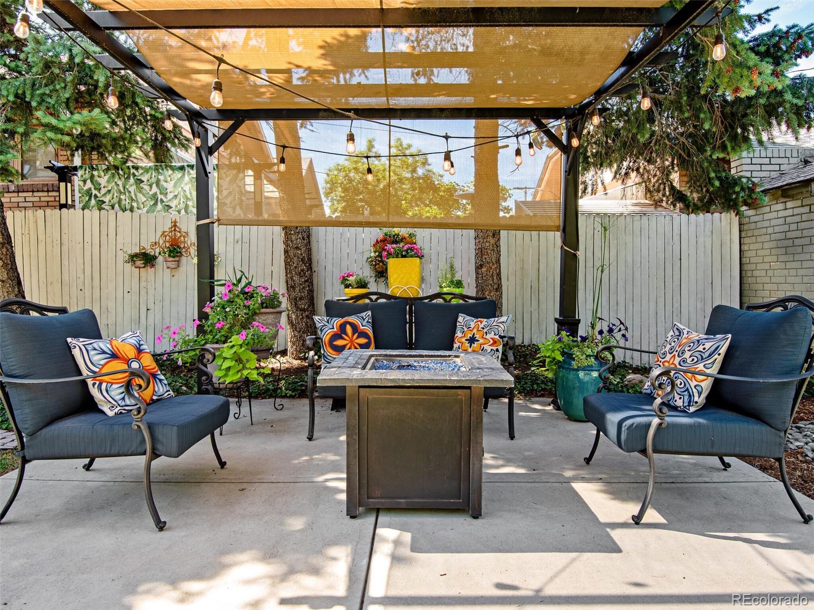 520 East 5th Avenue Denver, CO 80203 - Photo 29 of 40 a living room with patio furniture and a potted plant