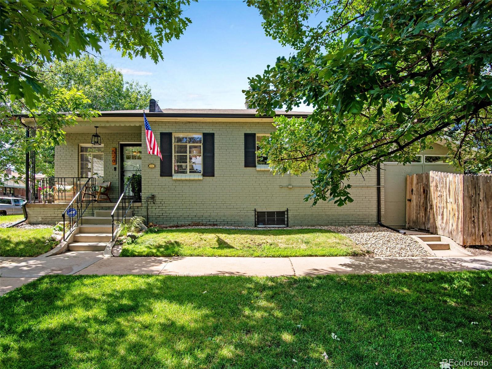 520 East 5th Avenue Denver, CO 80203 - Photo 3 of 40 a view of house with backyard and trees