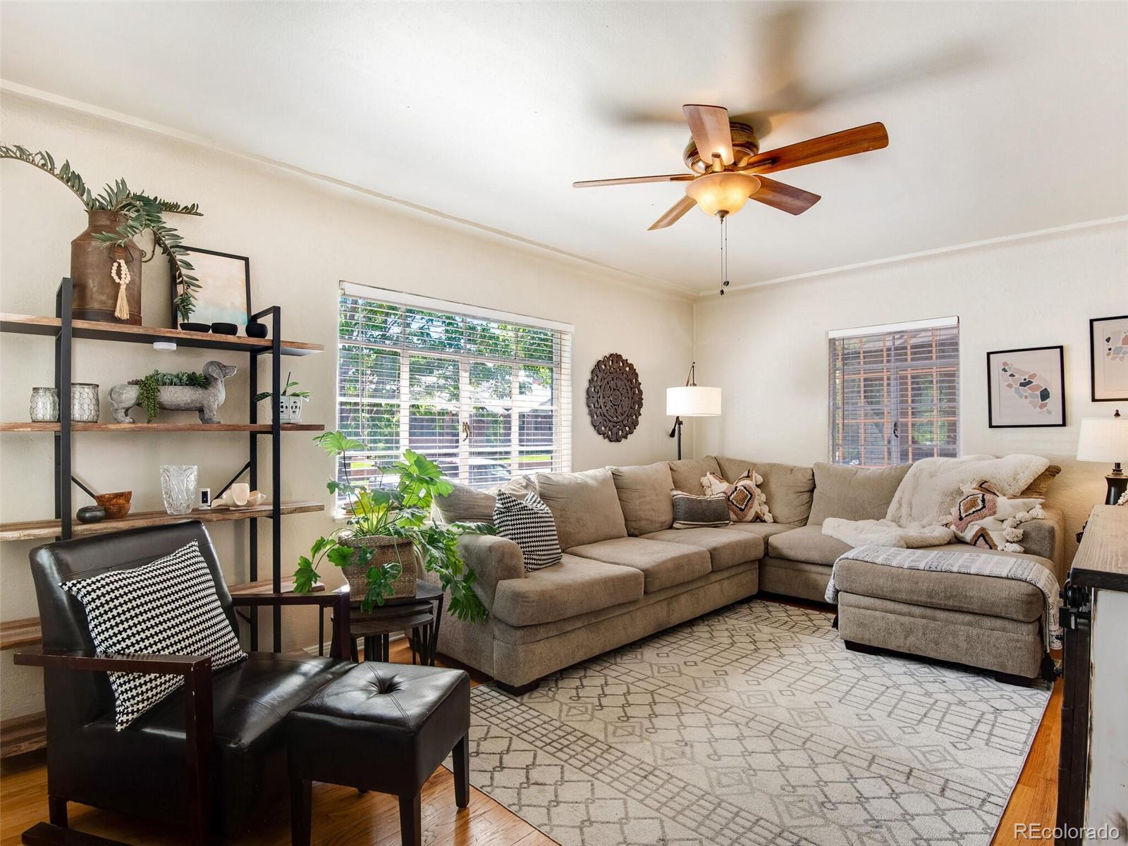 520 East 5th Avenue Denver, CO 80203 - Photo 6 of 40 a living room with furniture and a large window