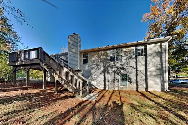 a view of balcony with wooden floor and fence