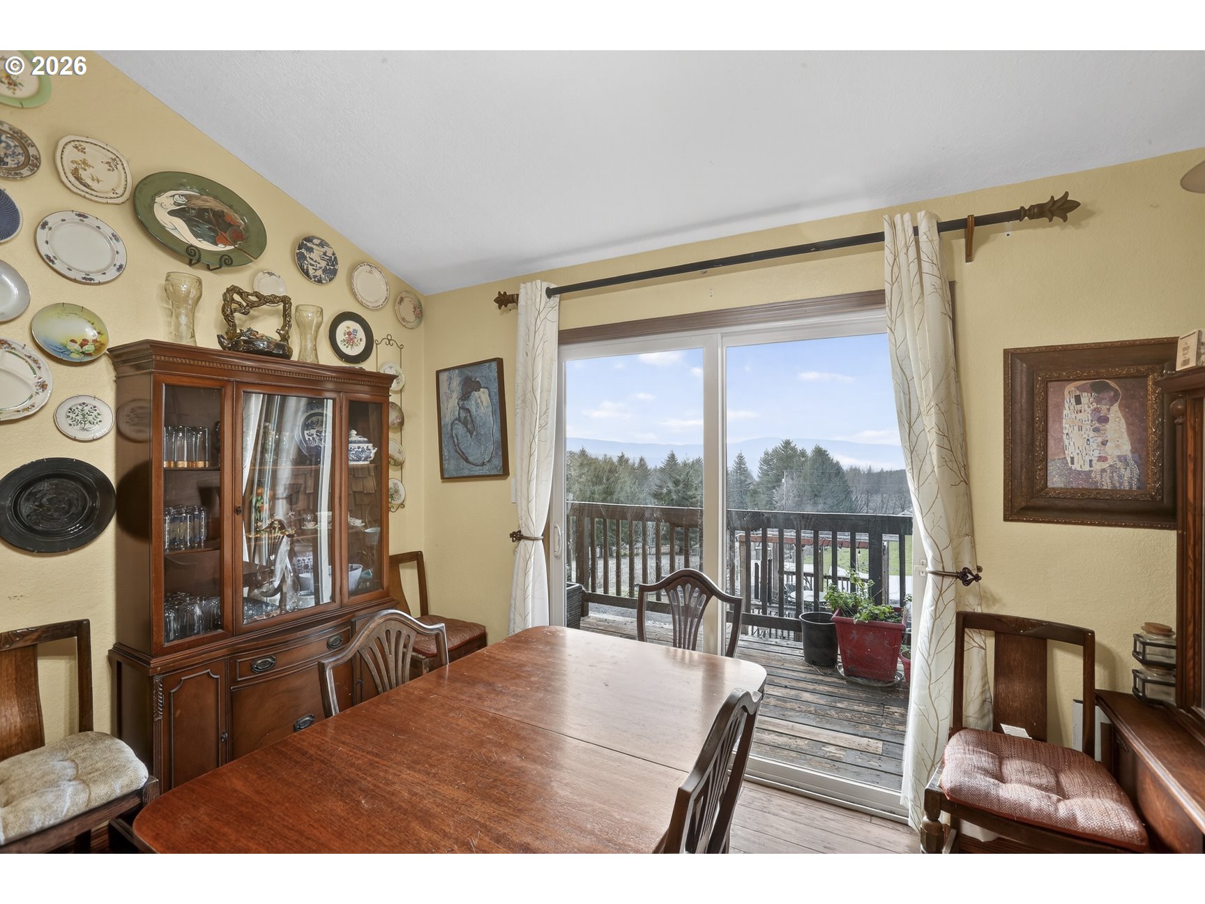 79372 Stewart Creek Road Clatskanie, OR 97016 - Photo 19 of 40 a living room with furniture and a floor to ceiling window