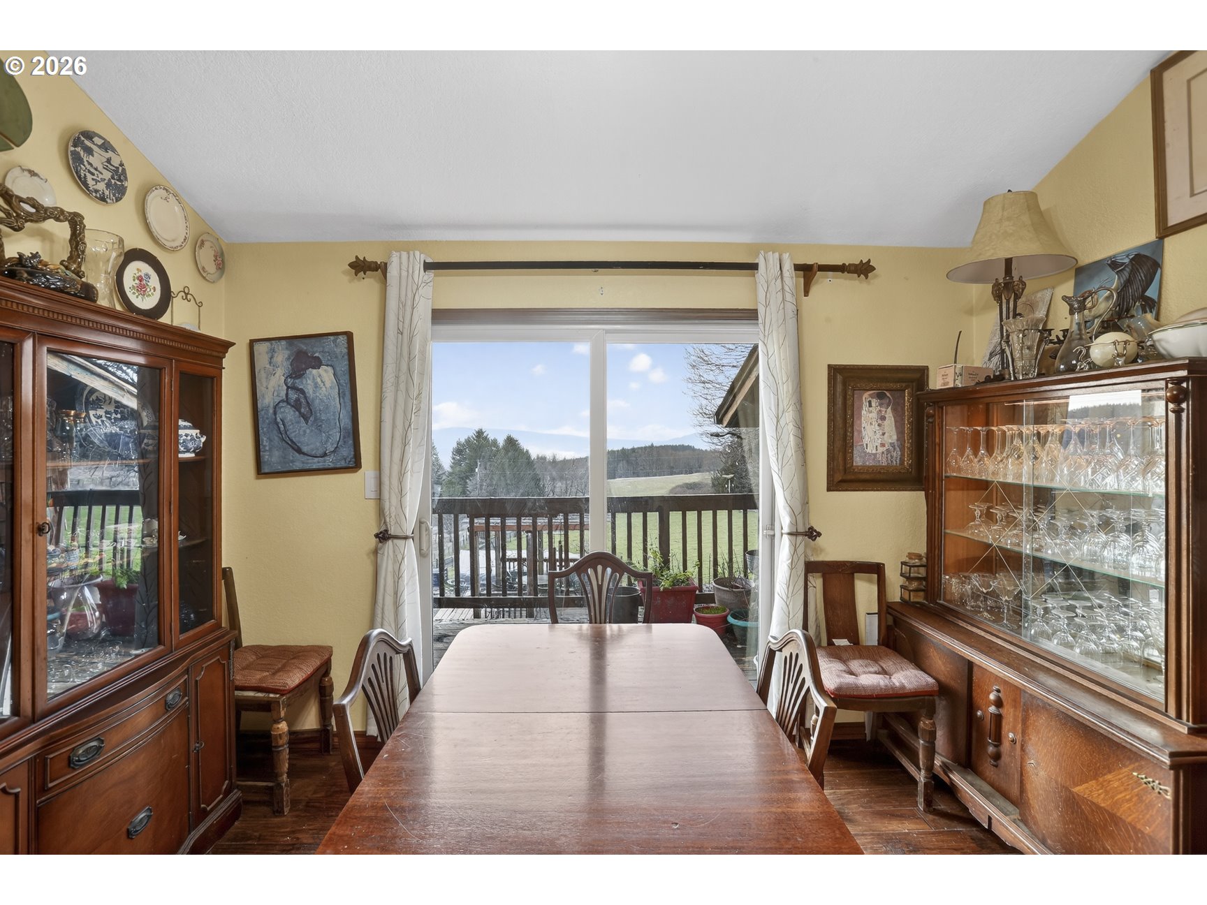 79372 Stewart Creek Road Clatskanie, OR 97016 - Photo 20 of 40 a balcony with furniture and a large window