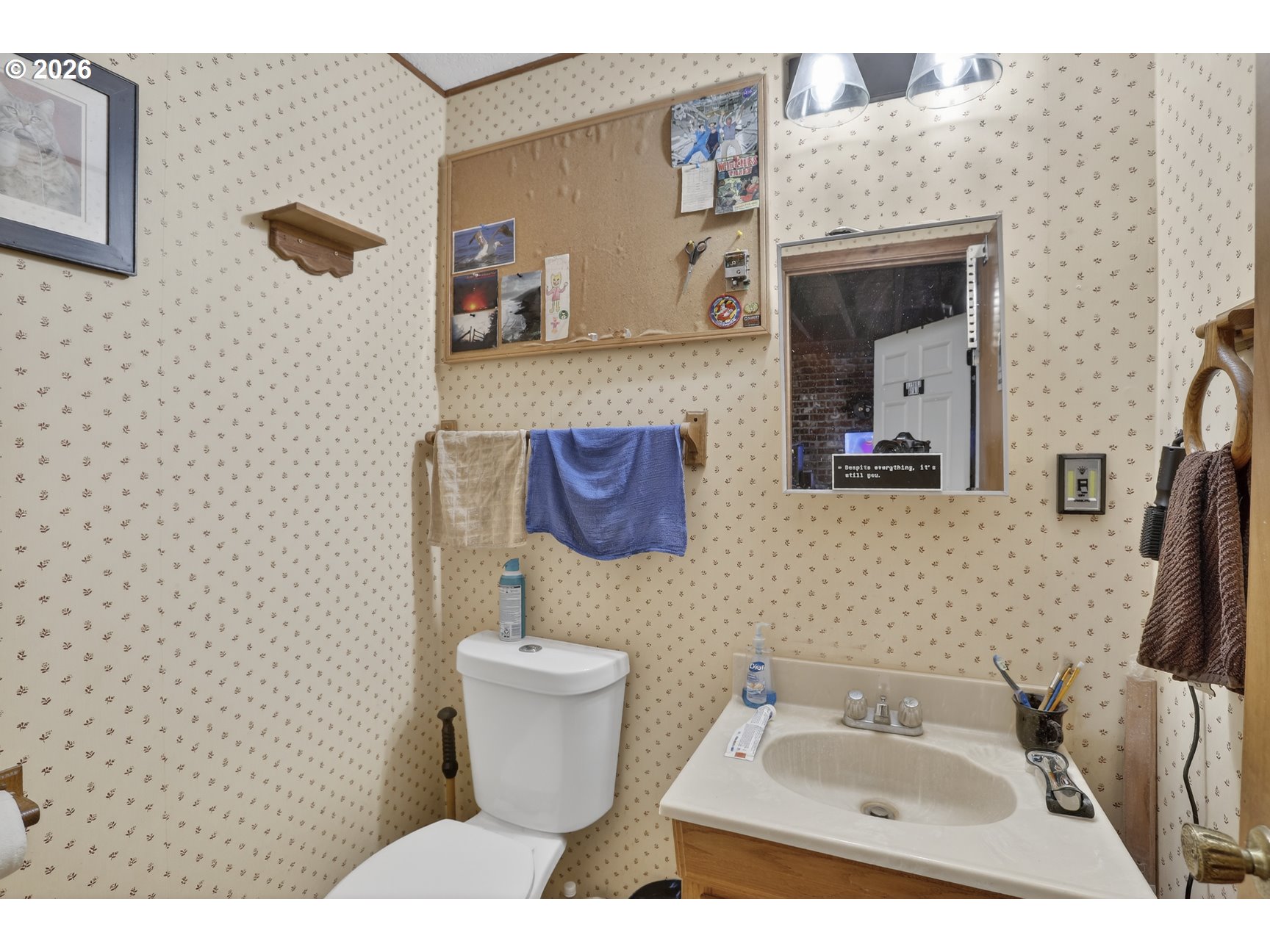 79372 Stewart Creek Road Clatskanie, OR 97016 - Photo 23 of 40 a bathroom with a toilet sink and mirror