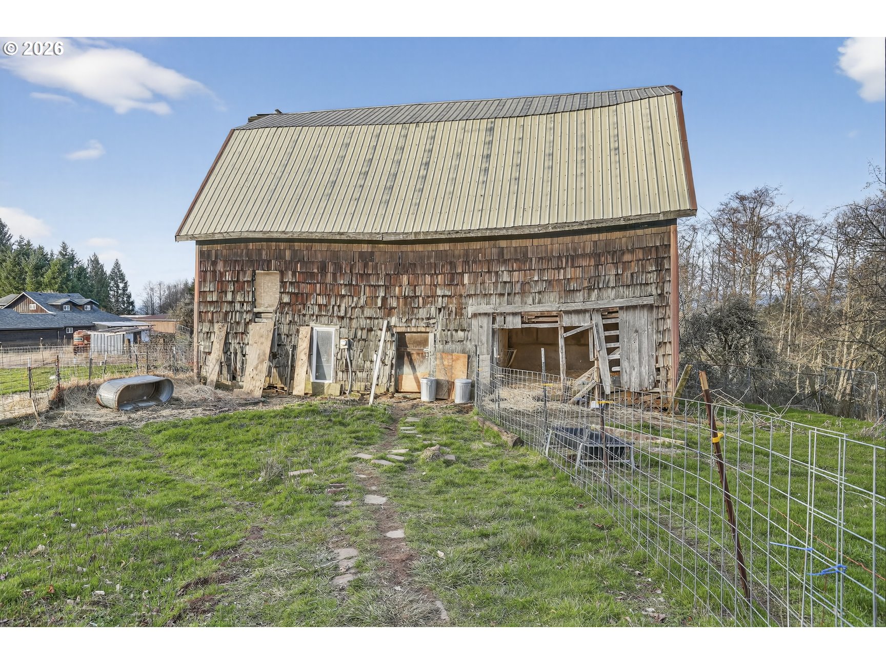 79372 Stewart Creek Road Clatskanie, OR 97016 - Photo 31 of 40 a front view of a house with a garden