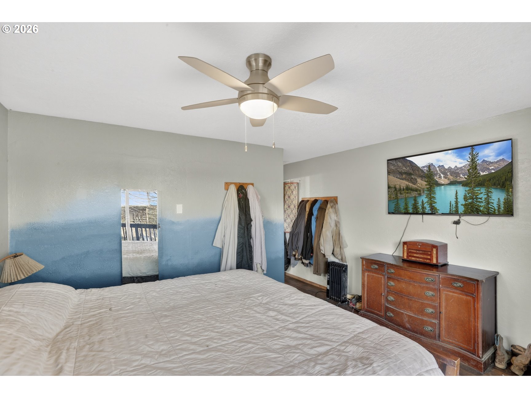 79372 Stewart Creek Road Clatskanie, OR 97016 - Photo 7 of 40 a bedroom with a bed and a television