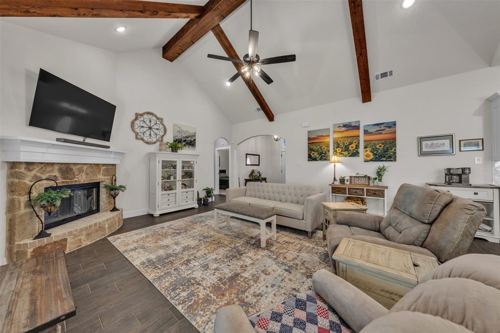 3000 Westfork Way Springtown, TX 76082 - Photo 11 of 35 a living room with furniture and a fireplace