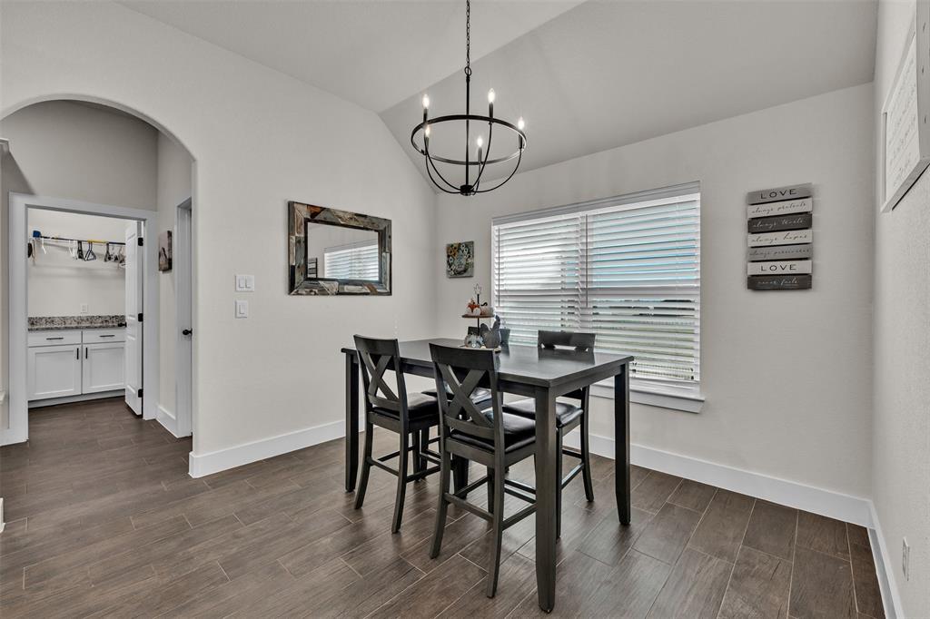 3000 Westfork Way Springtown, TX 76082 - Photo 19 of 35 a view of a dining room with furniture window and wooden floor