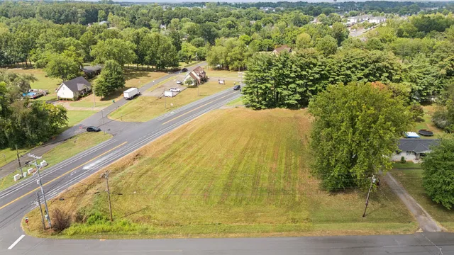 a view of a swimming pool with a yard