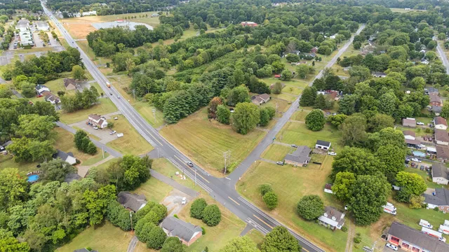 an aerial view of a residential houses with outdoor space