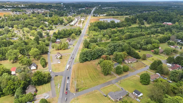 an aerial view of residential houses with outdoor space