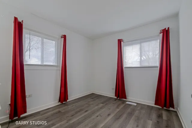 a view of a house with a yard and garage
