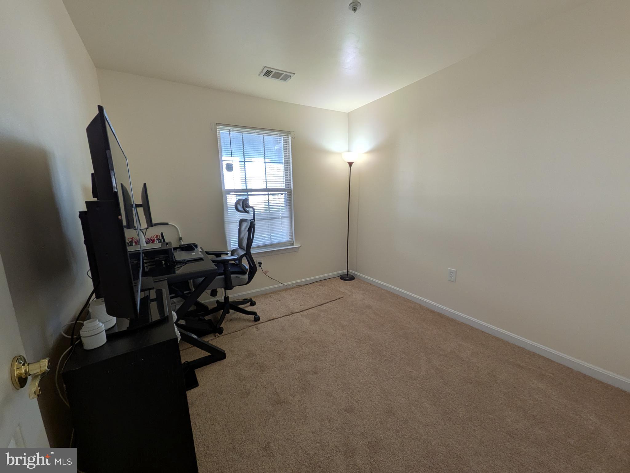 4240 Applegate Lane, Unit 5 Suitland, MD 20746 - Photo 17 of 27 a view of a workspace with furniture and a window