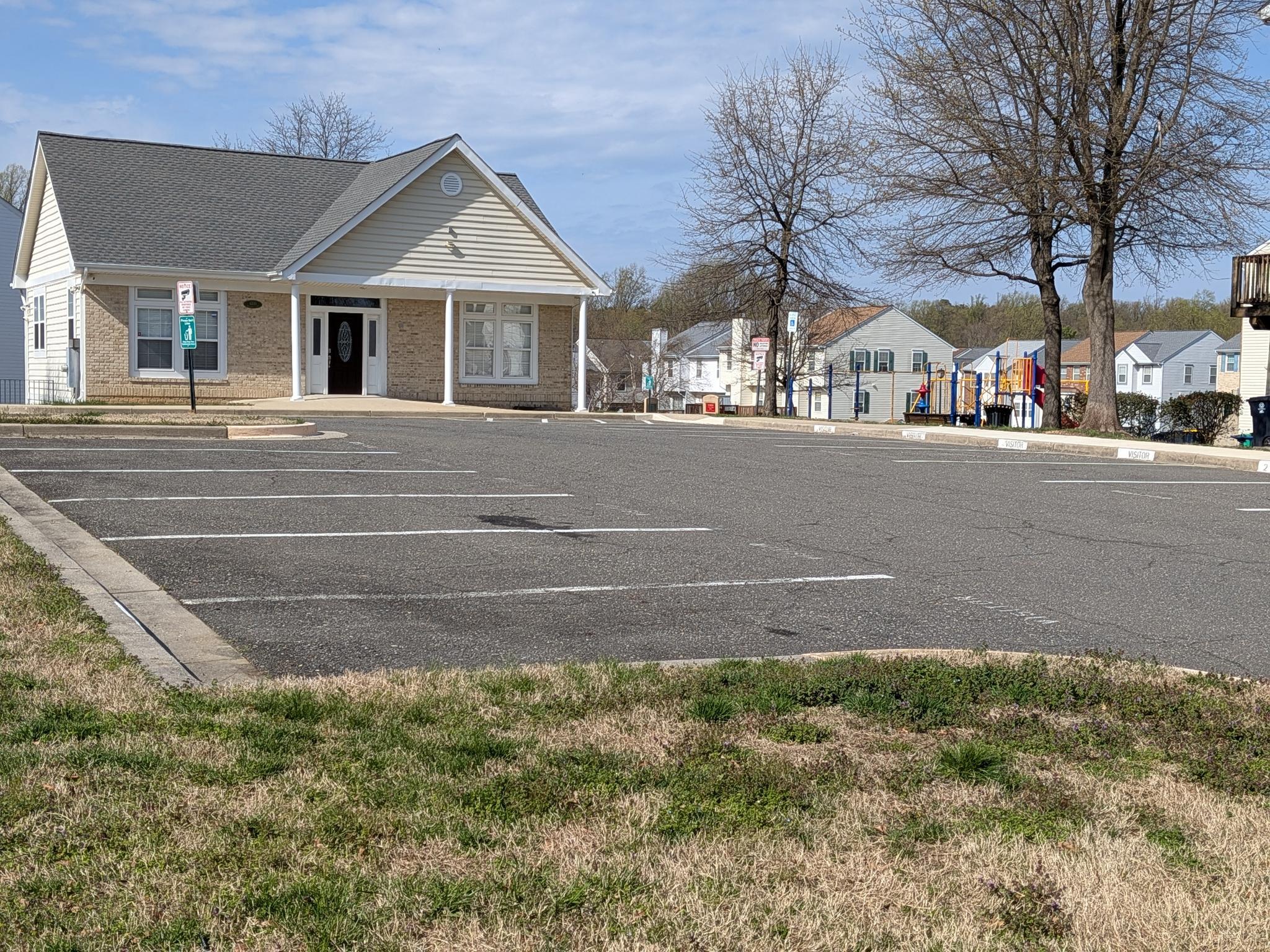 4240 Applegate Lane, Unit 5 Suitland, MD 20746 - Photo 21 of 27 a front view of a house with a yard