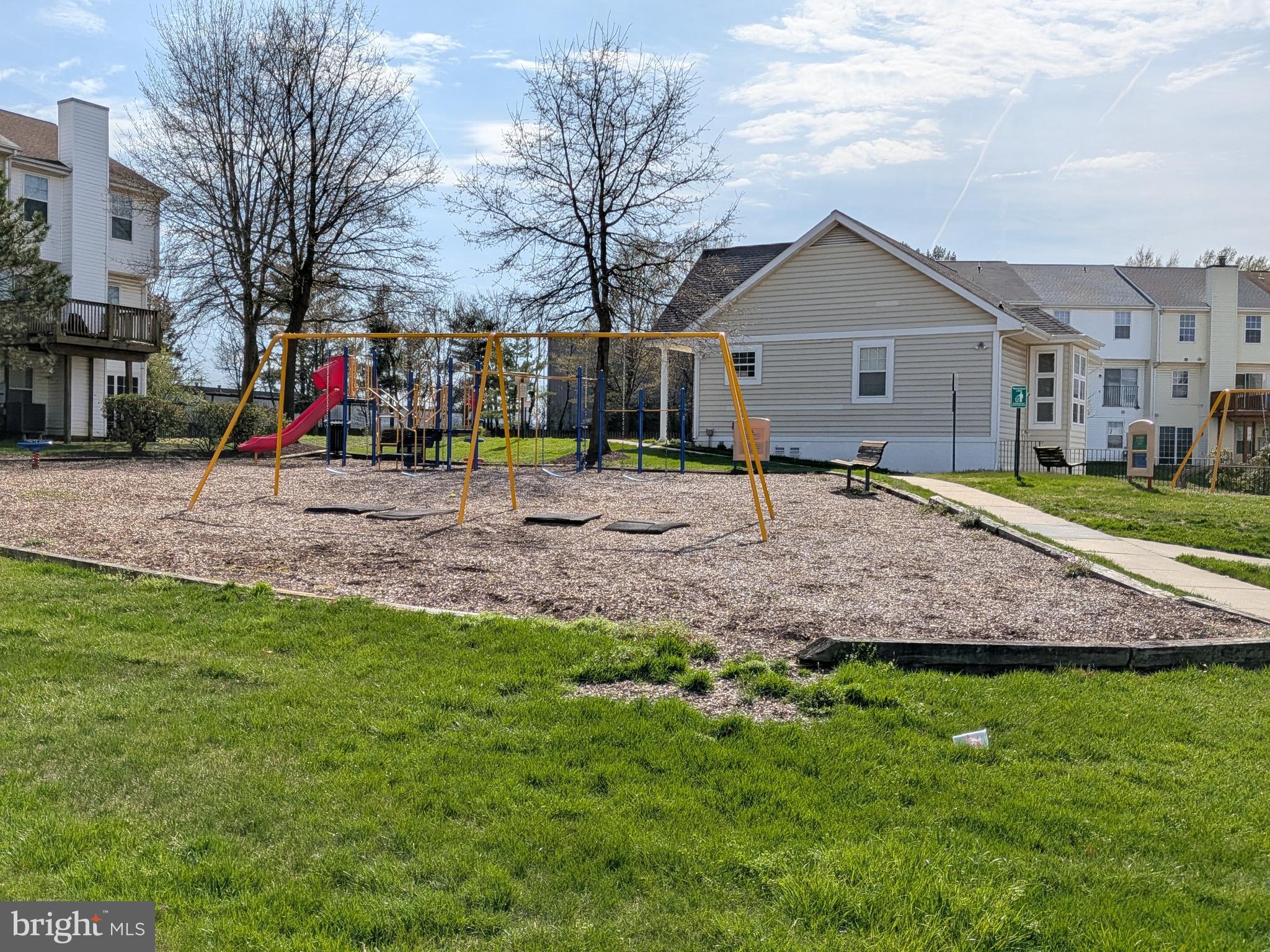 4240 Applegate Lane, Unit 5 Suitland, MD 20746 - Photo 27 of 27 a front view of house with swing and slide