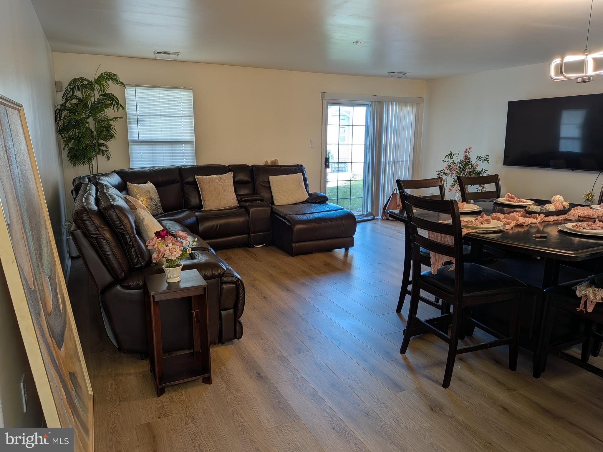 4240 Applegate Lane, Unit 5 Suitland, MD 20746 - Photo 4 of 27 a living room with furniture and a flat screen tv