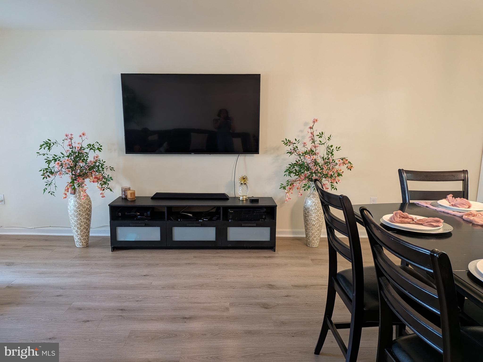 4240 Applegate Lane, Unit 5 Suitland, MD 20746 - Photo 5 of 27 a living room with furniture and a flat screen tv