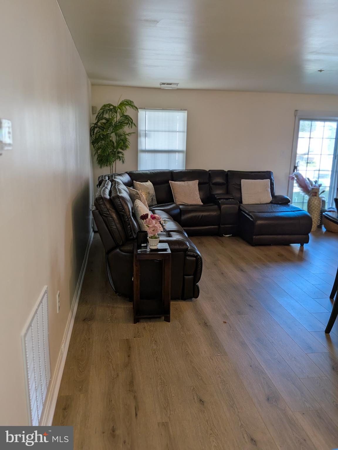 4240 Applegate Lane, Unit 5 Suitland, MD 20746 - Photo 7 of 27 a living room with furniture window and wooden floor