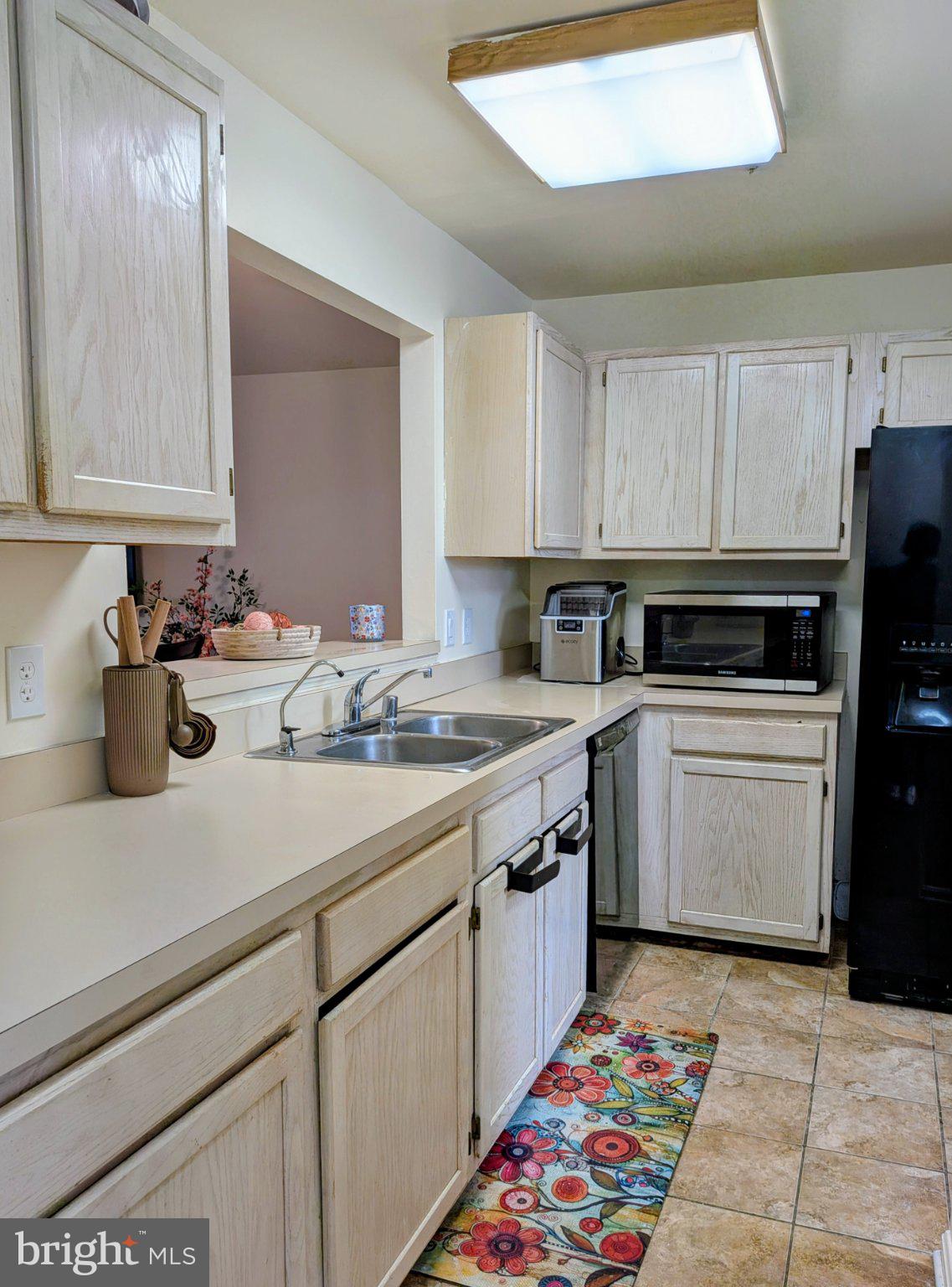 4240 Applegate Lane, Unit 5 Suitland, MD 20746 - Photo 9 of 27 a kitchen with a sink stove and cabinets