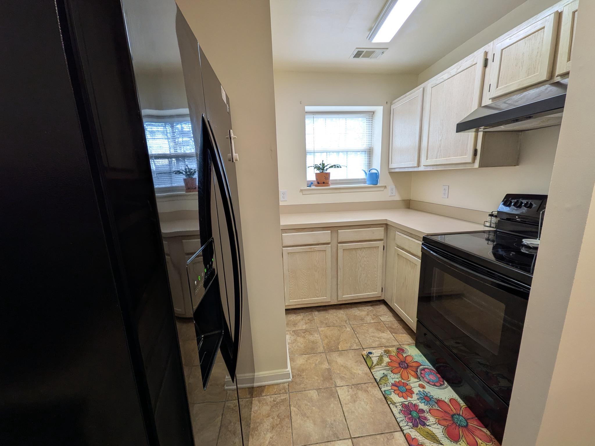 4240 Applegate Lane, Unit 5 Suitland, MD 20746 - Photo 10 of 27 a kitchen with white cabinets and appliances