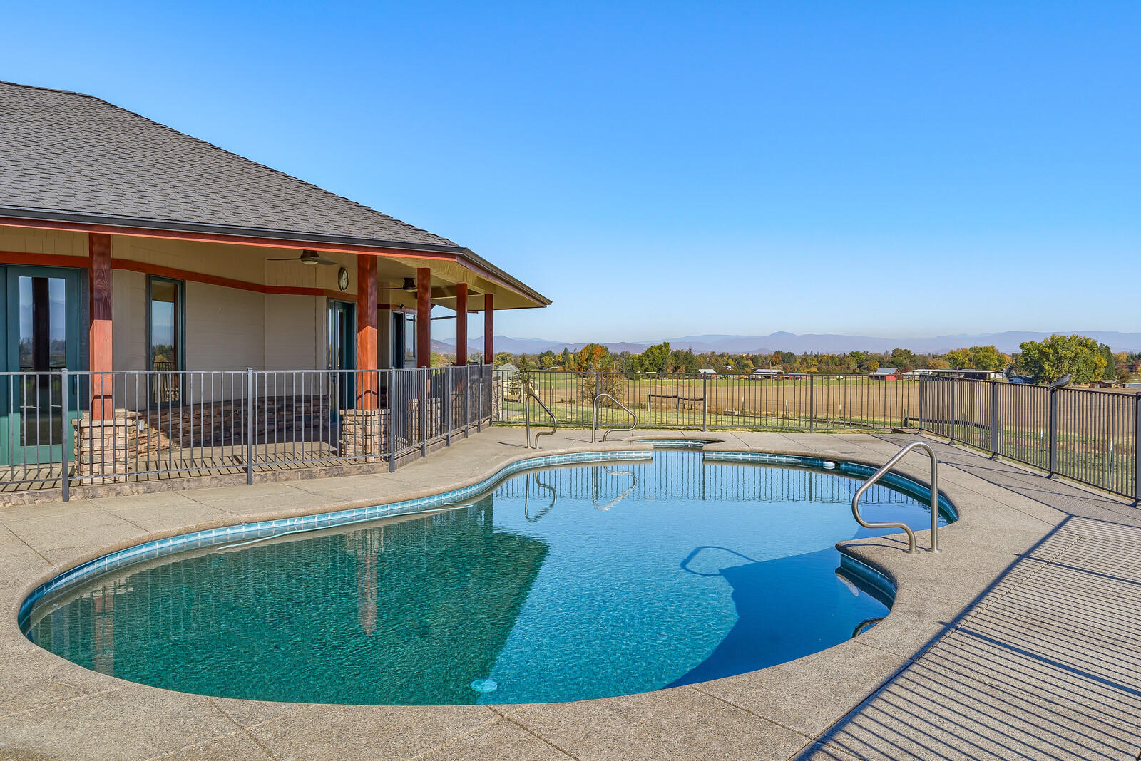 5405-5413 Seven Oaks Road Central Point, OR 97502 - Photo 15 of 65 a view of a swimming pool with an outdoor seating