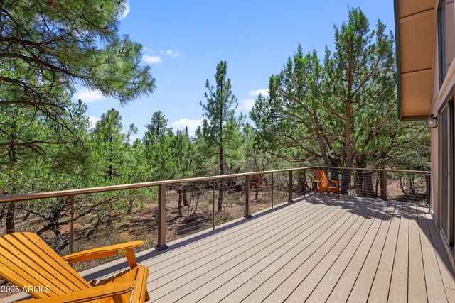 a view of balcony with wooden floor and outdoor seating