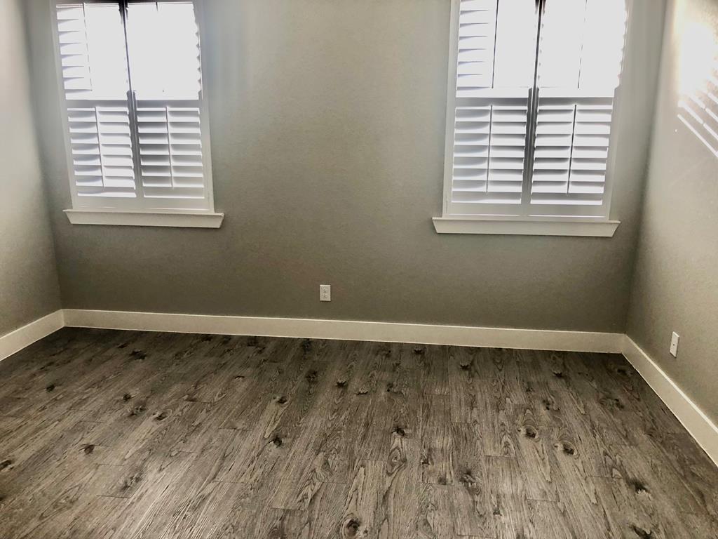 229 Riley Lane Fredericksburg, TX 78624 - Photo 8 of 16 a view of a room with wooden floor and a window