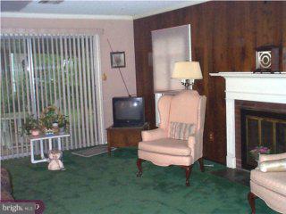 60 Terrace Road Levittown, PA 19056 - Photo 3 of 3 a living room with furniture and a fireplace