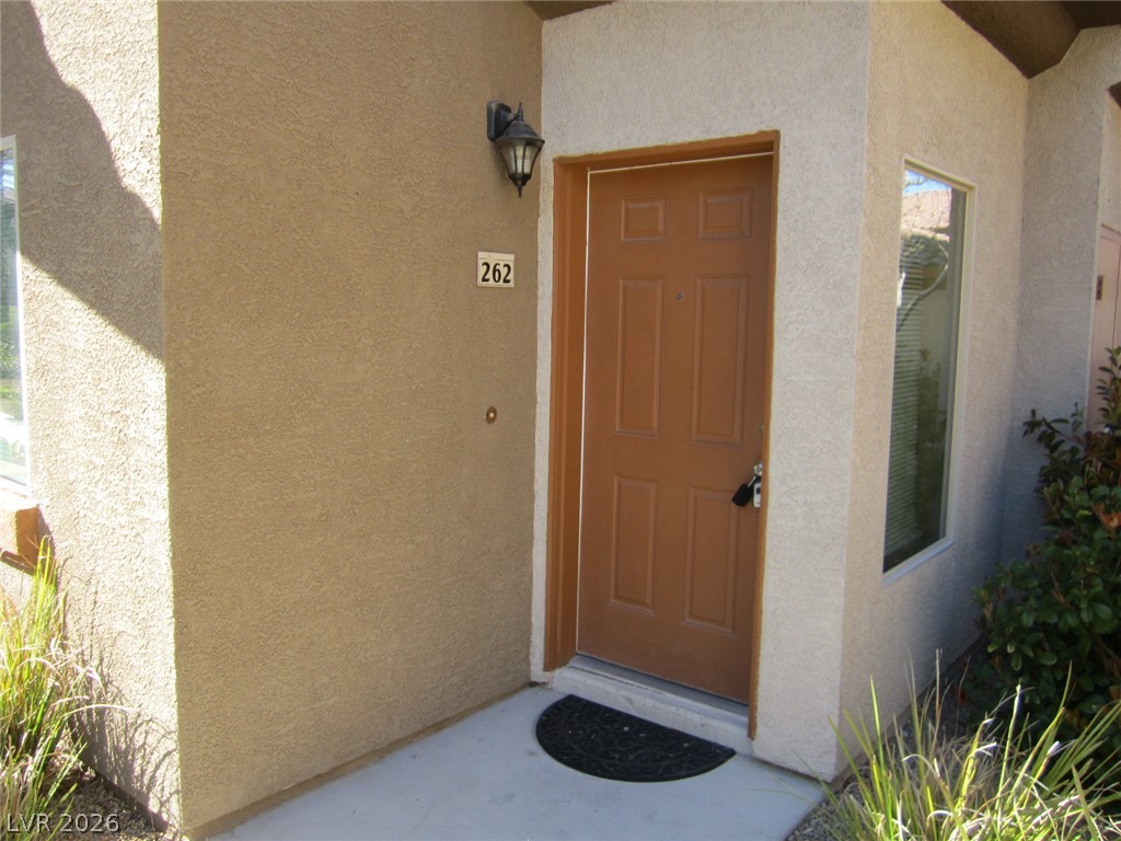 7701 West Robindale Road, Unit 262 Las Vegas, NV 89113 - Photo 4 of 26 A welcoming entry point with natural light filtering through the adjacent window.