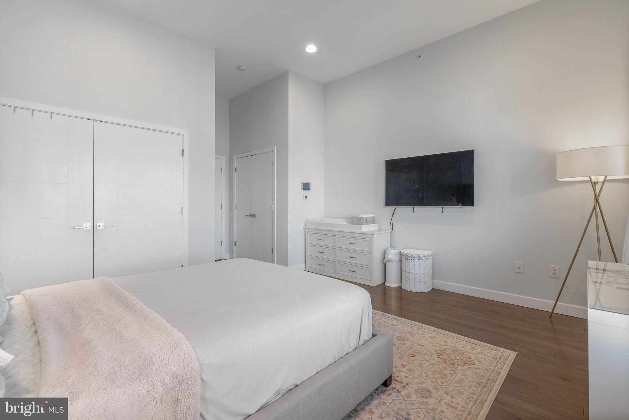 1753 North Marshall Street, Unit B Philadelphia, PA 19122 - Photo 15 of 34 a bedroom with a bed and a flat screen tv