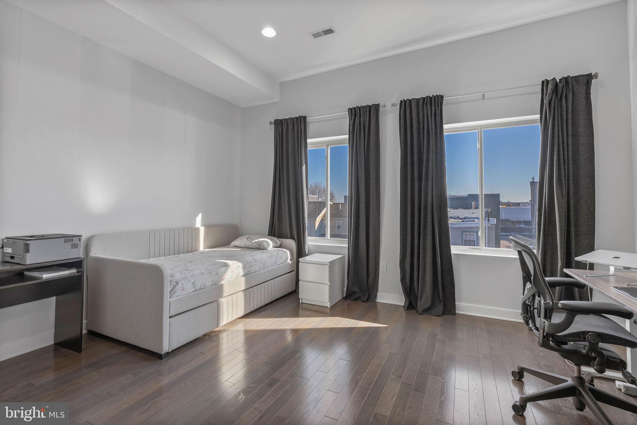 1753 North Marshall Street, Unit B Philadelphia, PA 19122 - Photo 17 of 34 a living room with furniture and a flat screen tv