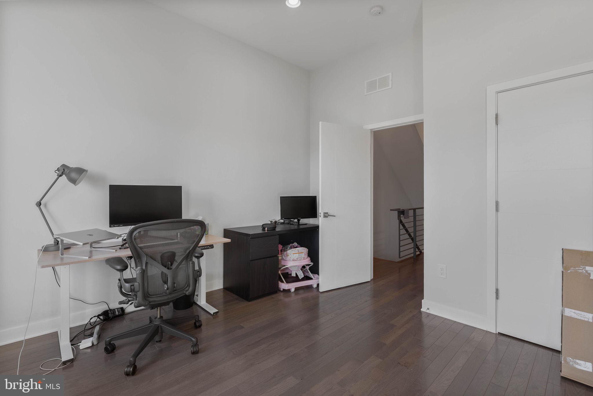 1753 North Marshall Street, Unit B Philadelphia, PA 19122 - Photo 18 of 34 a view of a workspace with furniture and a window