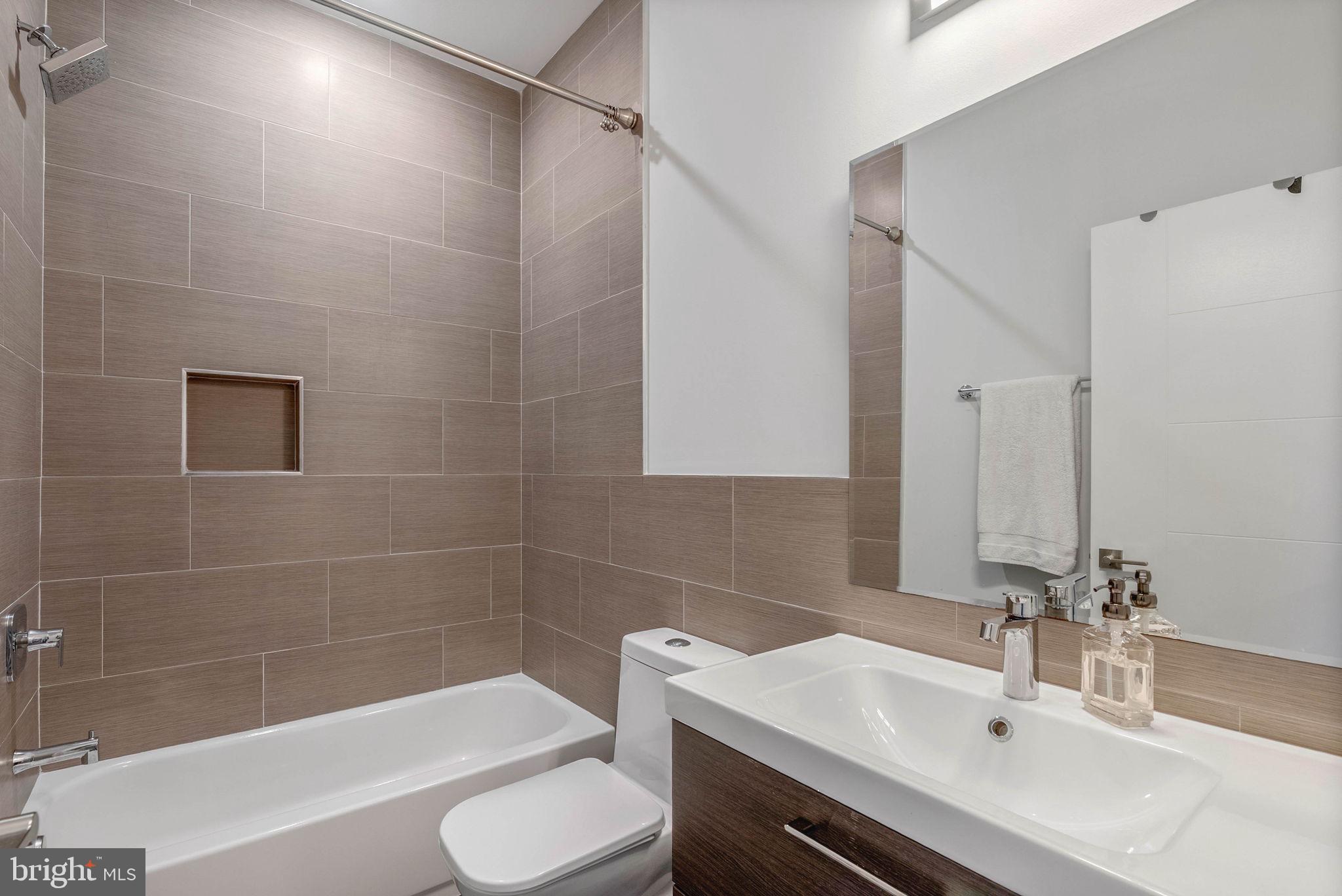 1753 North Marshall Street, Unit B Philadelphia, PA 19122 - Photo 19 of 34 a bathroom with a sink and a mirror