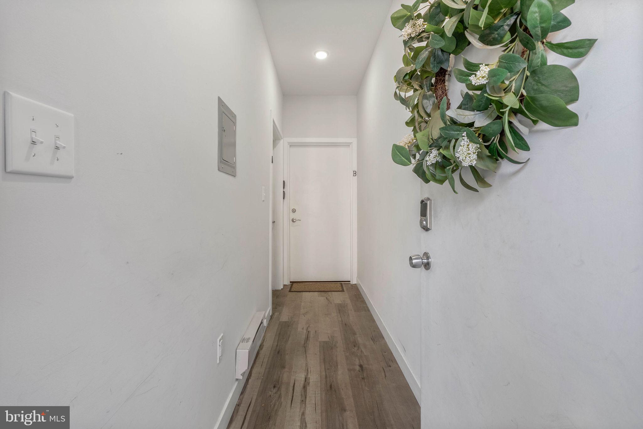 1753 North Marshall Street, Unit B Philadelphia, PA 19122 - Photo 29 of 34 a view of a hallway with wooden floor