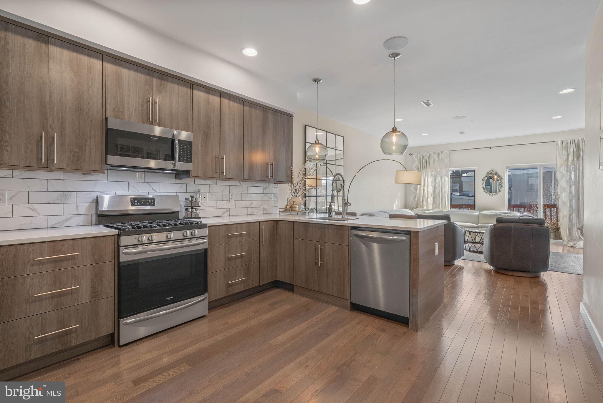 1753 North Marshall Street, Unit B Philadelphia, PA 19122 - Photo 6 of 34 a kitchen with a sink cabinets and stainless steel appliances