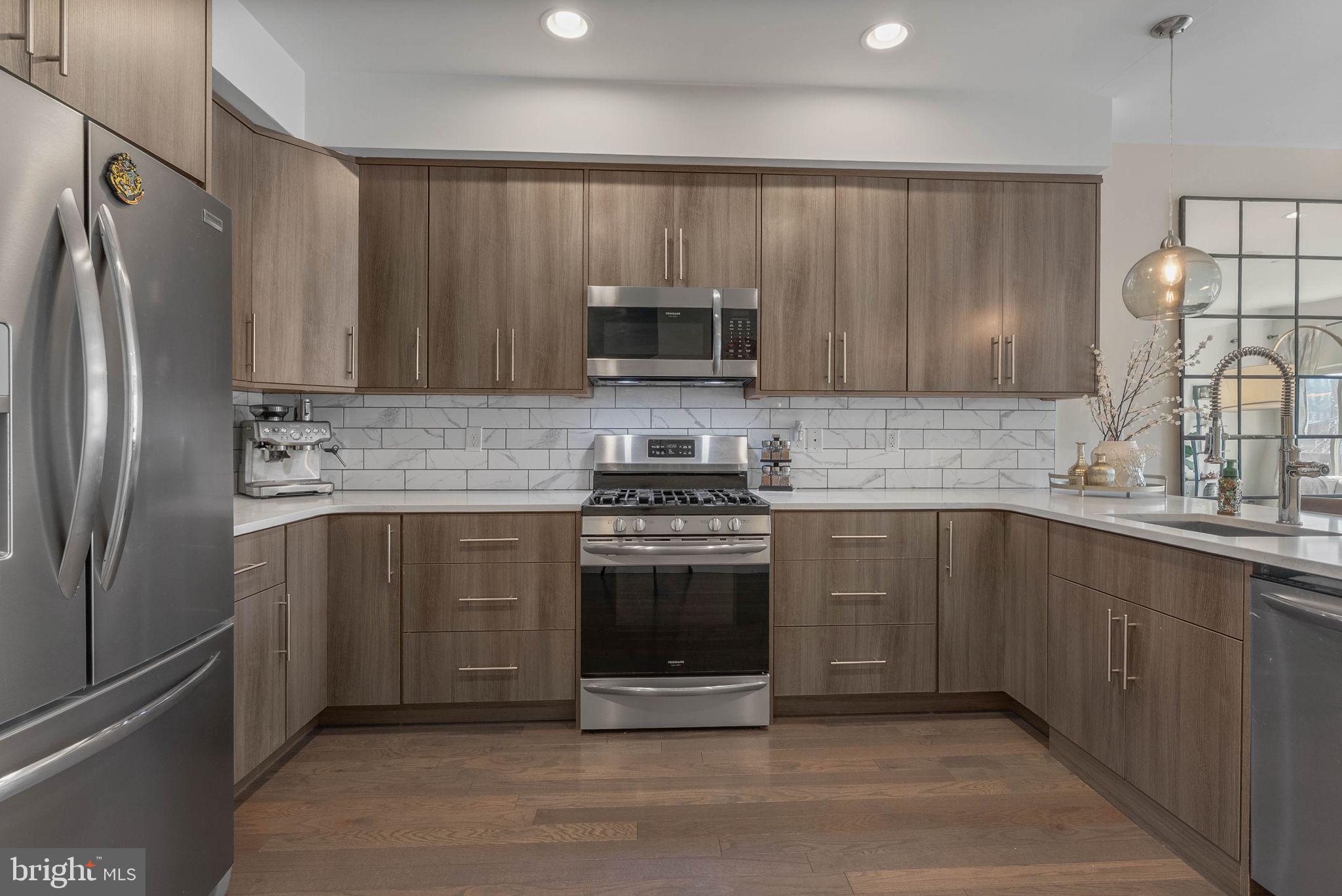 1753 North Marshall Street, Unit B Philadelphia, PA 19122 - Photo 7 of 34 a kitchen with a sink stove and refrigerator