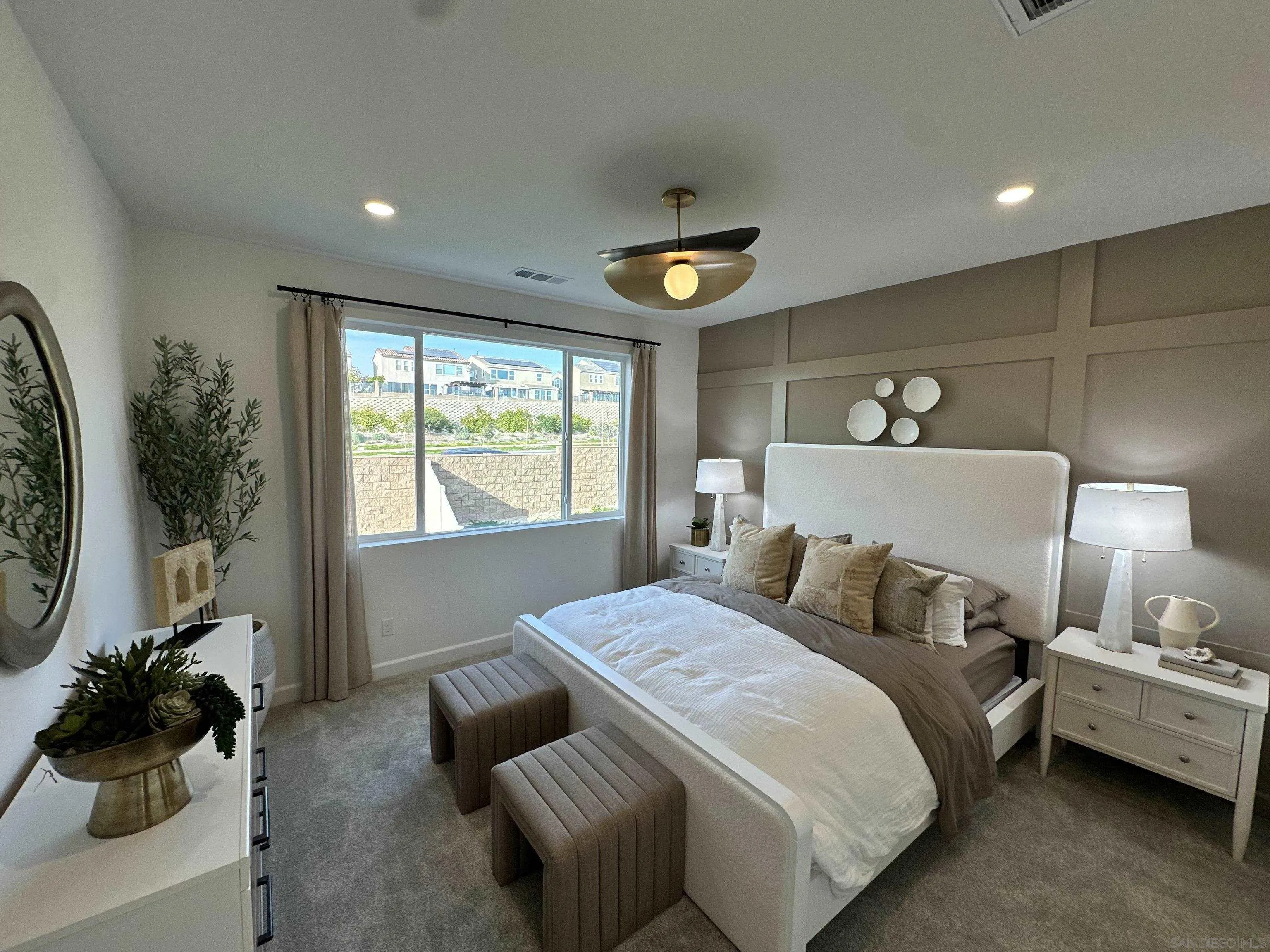 2186 Tributary Drive Chula Vista, CA 91913 - Photo 21 of 30 a bedroom with a bed and a chandelier