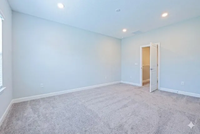 a bedroom with a bed and a desk