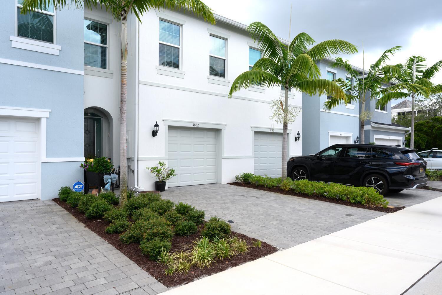 1832 Southeast Roxy Way Stuart, FL 34996 - Photo 2 of 30 a couple of cars parked in front of a house