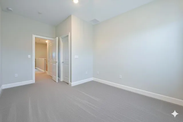 a bedroom with a bed and a desk