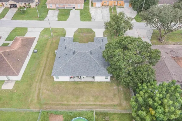 an aerial view of a house with swimming pool