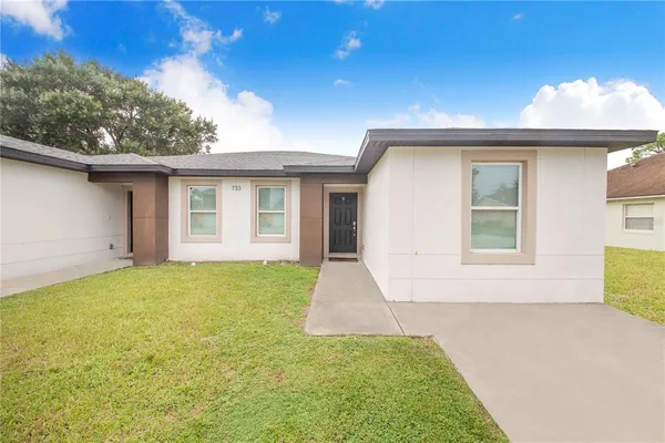 a view of a backyard with a garden and plants