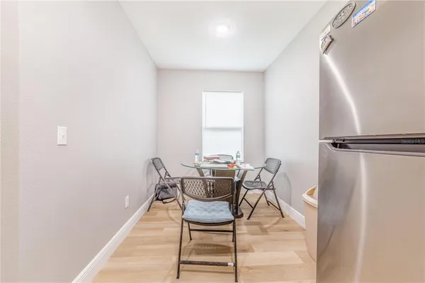 a dining room with furniture and window