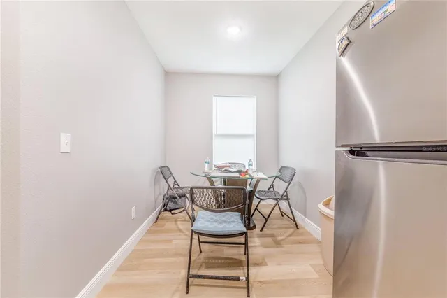 a dining room with furniture and window