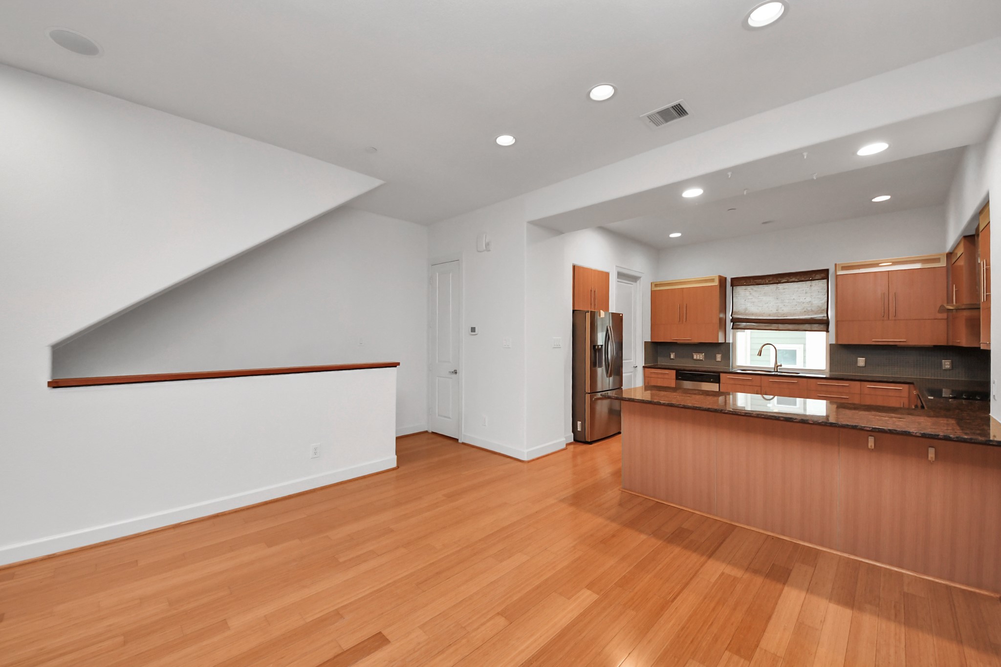 1403 Delano Street, Unit 6 Houston, TX 77003 - Photo 13 of 46 a view of a kitchen with a sink and a refrigerator