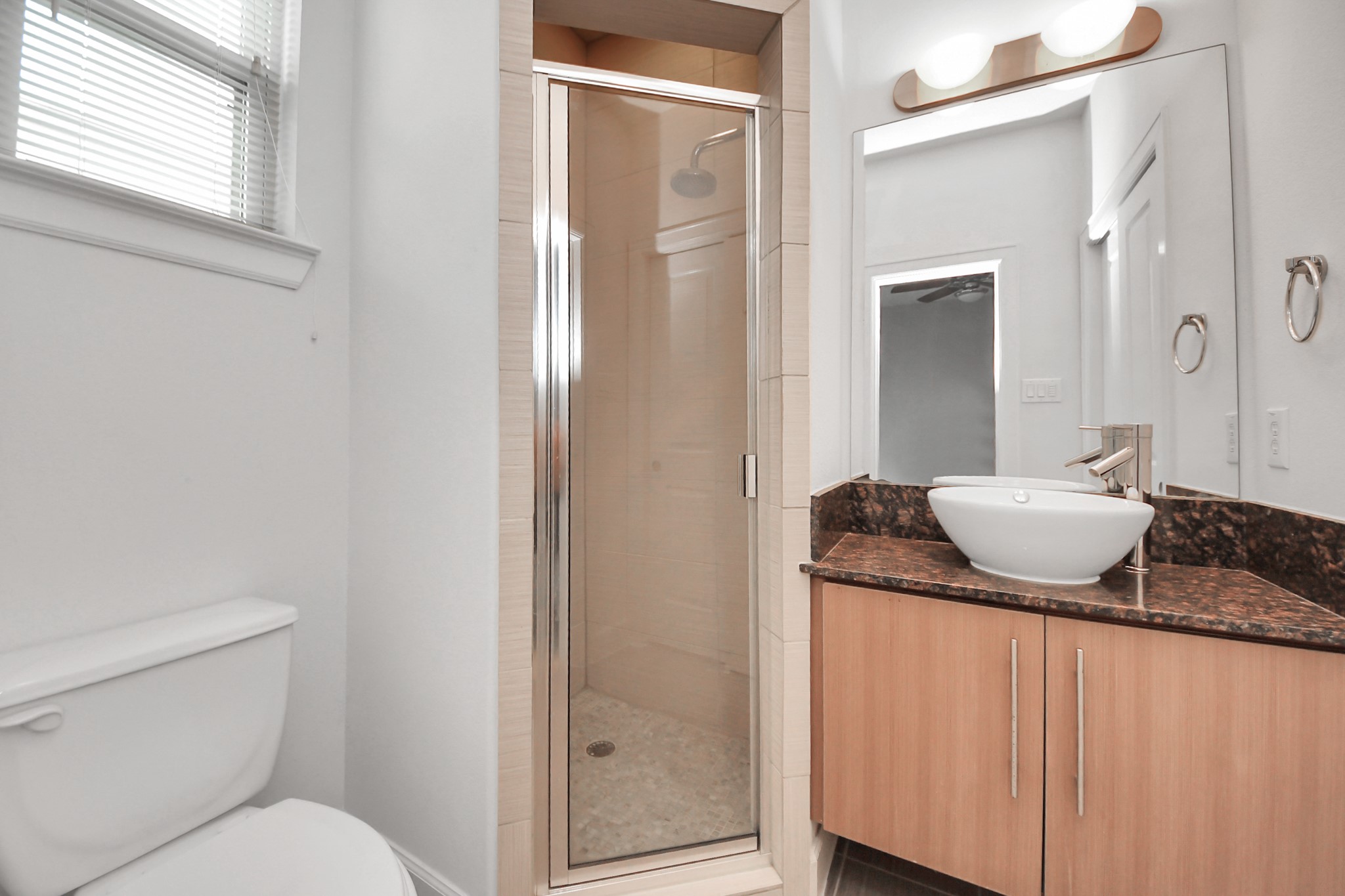 1403 Delano Street, Unit 6 Houston, TX 77003 - Photo 22 of 46 a bathroom with a granite countertop sink and a mirror