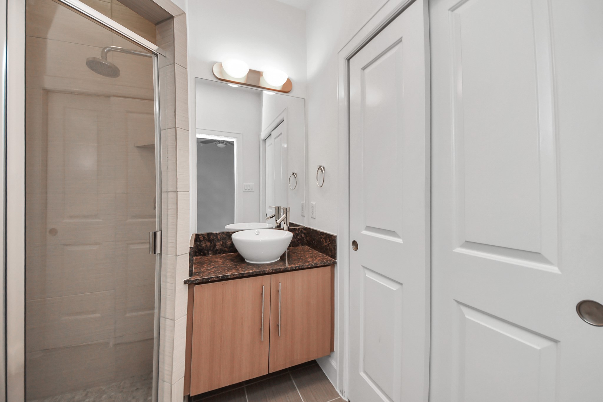 1403 Delano Street, Unit 6 Houston, TX 77003 - Photo 24 of 46 a bathroom with a granite countertop sink and mirror