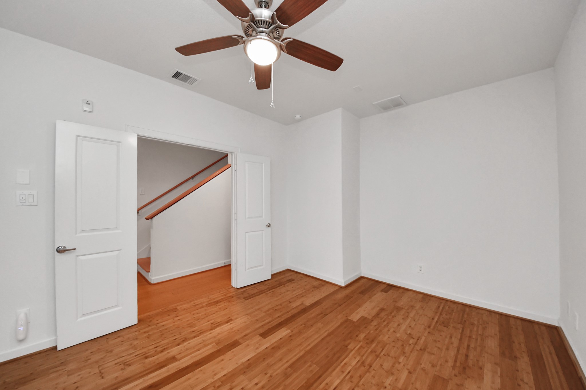 1403 Delano Street, Unit 6 Houston, TX 77003 - Photo 35 of 46 wooden floor in an empty room