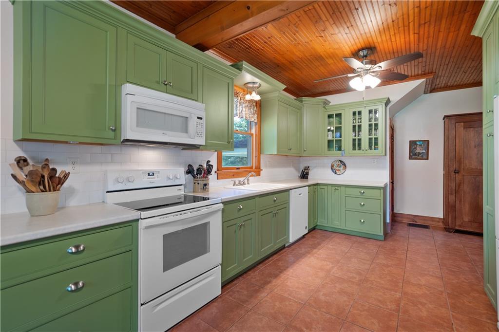 645 Cemetery Road Perryopolis, PA 15473 - Photo 12 of 31 a kitchen with a sink cabinets and stainless steel appliances