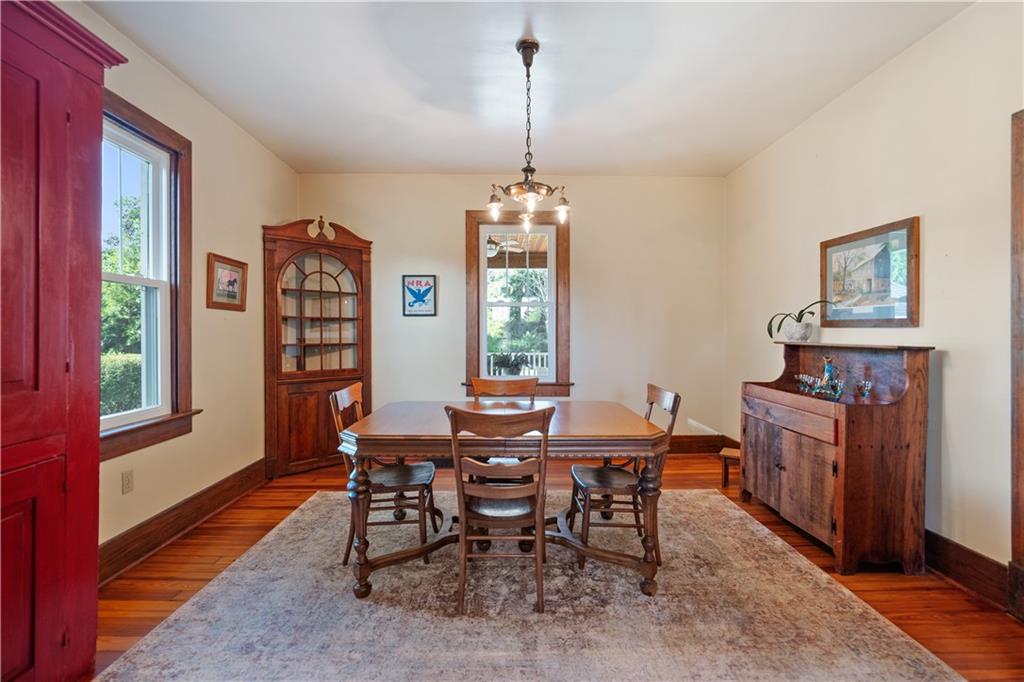 645 Cemetery Road Perryopolis, PA 15473 - Photo 15 of 31 a view of a dining room with furniture window and wooden floor